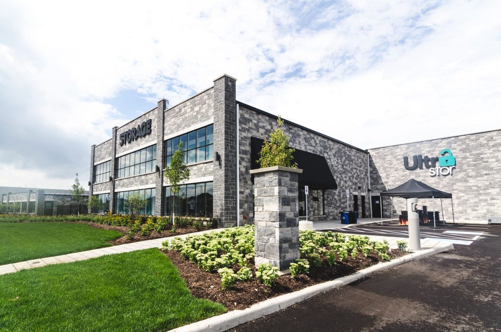 Front of the UltraStor Burlington location, with gardens and the driveway.