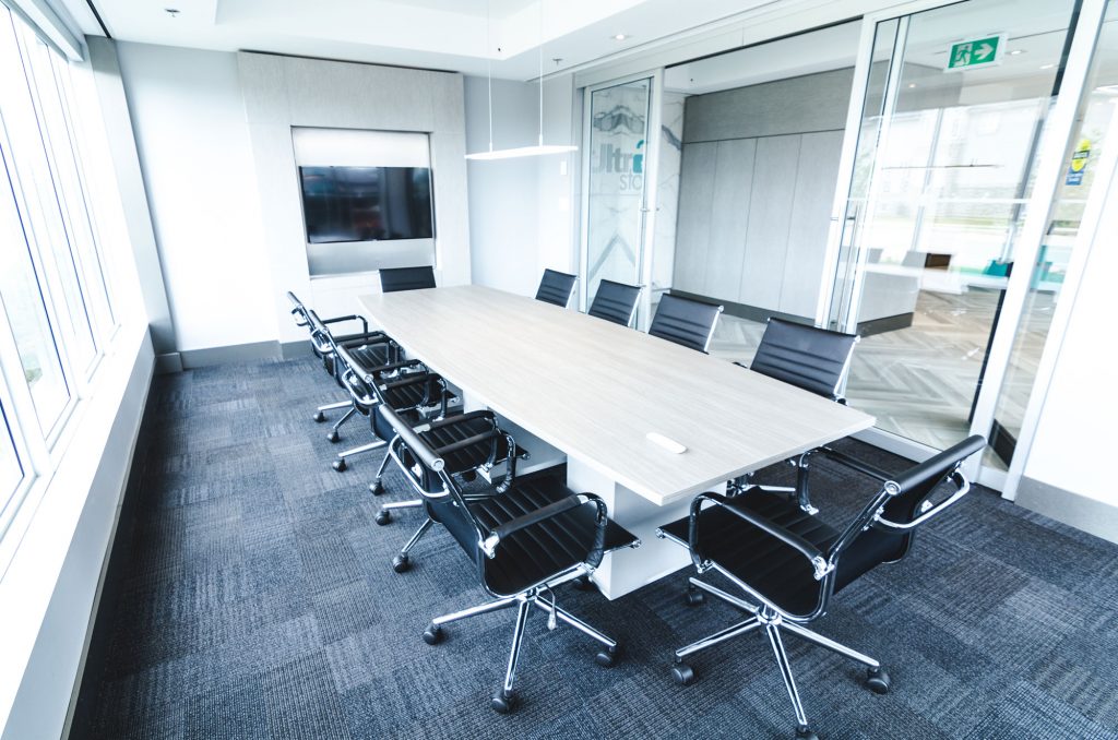 UltraStor Burlington boardroom with television and space for up to 12 people.